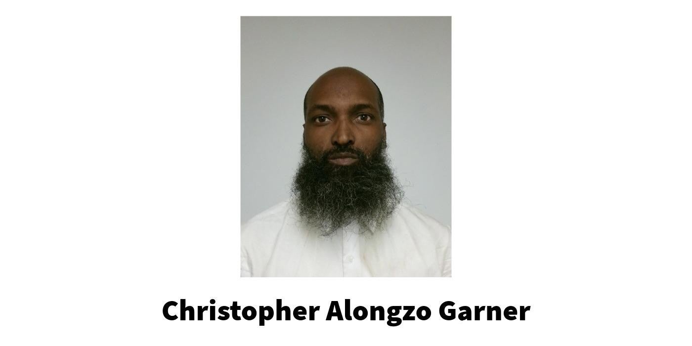 A man wearing a white shirt. Christopher Alongzo Garner.